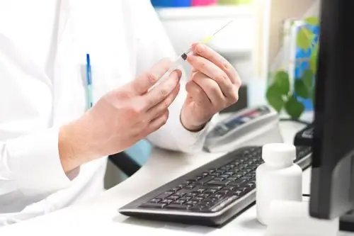 Pharmacist preparing an immunization at the pharmacy