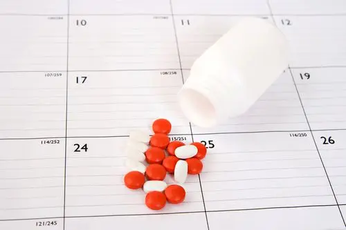 Prescription bottles organized for pickup at the pharmacy